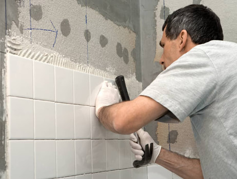 man doing tile grout work